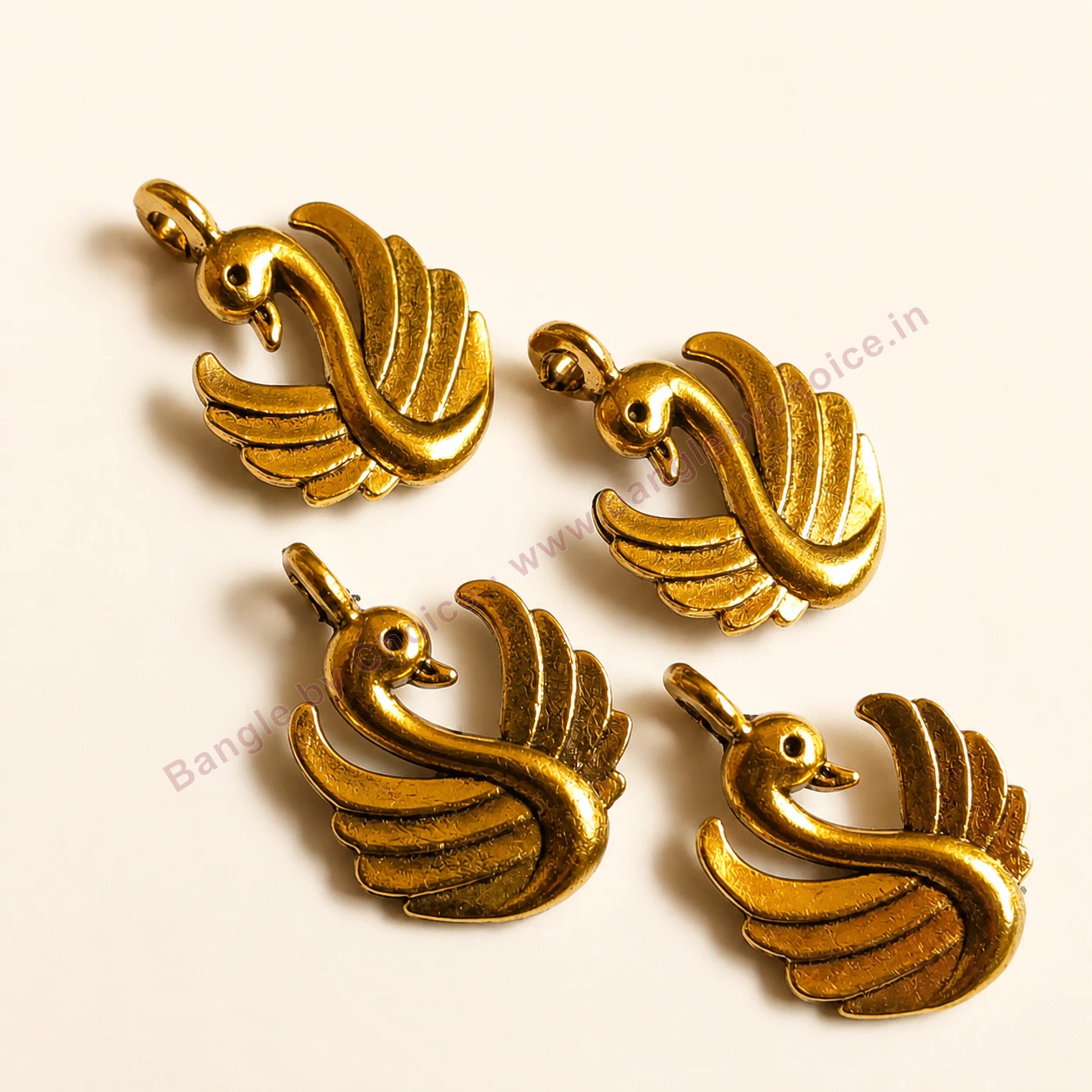 Photo of double face swan charms